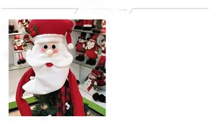 Detail of plush Santa Claus tree topper hat with red ribbons for Christmas decoration
