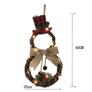 Detail of 40cm LED snowman rattan wreath with buffalo plaid hat and warm lights