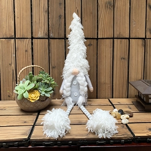 Nordic Christmas gnome plush doll with long striped legs and white pointed fur hat