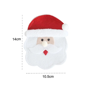 Detail view of a 14x10.5cm felt Santa cutlery holder for Christmas table settings