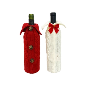 Knitted Christmas wine bottle covers with cable patterns in red and white colors