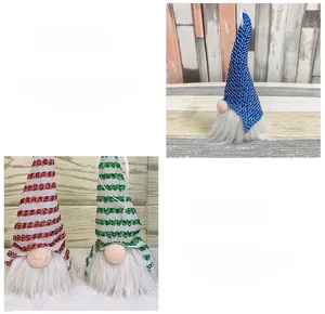 Three festive Christmas gnome plush ornaments with sequins and long white beards in detail
