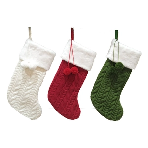 Three-piece knitted Christmas stockings set in red, green, and white with faux fur cuffs