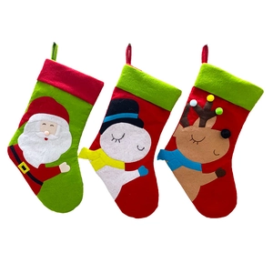 Three-piece Christmas stocking set featuring Santa, snowman, and reindeer on white background