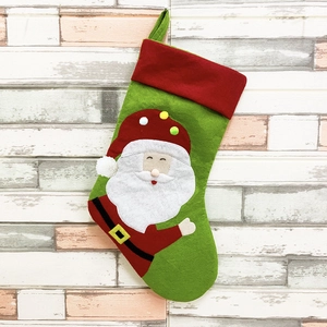 Classic green and red Christmas stocking with Santa Claus embroidery and festive pom-pom