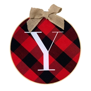 Detail view of rustic JOY Christmas wreath featuring buffalo plaid fabric and burlap bow