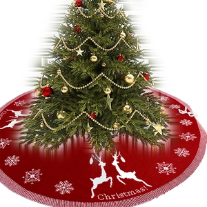 Red knitted Christmas tree skirt with white reindeer and snowflake pattern decoration