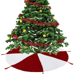 Knitted Christmas tree skirt with red and white tassels for holiday home decoration