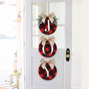 Detail of JOY rustic buffalo plaid door hangers with burlap bows and pine needles