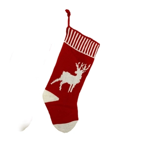 Classic red and white knitted Christmas stocking with reindeer pattern and hanging loop