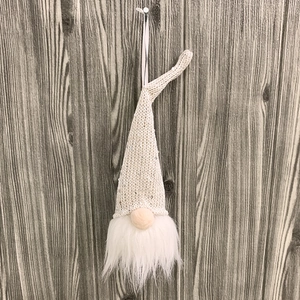 Detail view of a Nordic Christmas Gnome ornament with sequined knit hat and white faux fur beard
