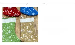 Detailed knitted Christmas stockings with snowflake patterns in red, blue, and green