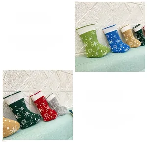 Detail view of knitted Christmas stockings with snowflake patterns in various colors