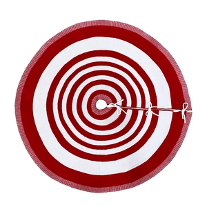 Close-up of red and white striped knit Christmas tree skirt with white ribbon ties
