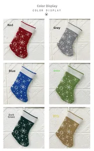 Detail of six knitted Christmas socks with snowflake patterns in various festive colors
