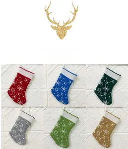 Detail of six colorful knitted Christmas stockings with white snowflake patterns and loops