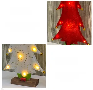 Detail of red and white felt Christmas tree ornaments with LED lights and wooden base