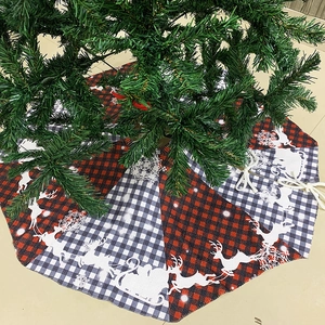Classic red and black buffalo plaid Christmas tree skirt with white reindeer and sled print