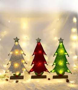 Three felt Christmas tree ornaments with LED lights, golden stars and wooden bases