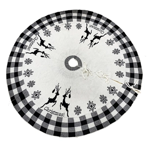 Round black and white plaid Christmas tree skirt with reindeer and snowflake patterns
