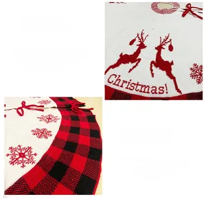 Detail of knitted Christmas tree skirt featuring red reindeer, snowflakes and plaid border