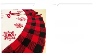 Detail of red and black buffalo plaid Christmas tree skirt with white snowflake embroidery