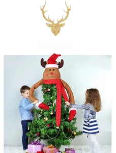 Christmas tree topper deer with long arms and red snowflake scarf in home holiday setting