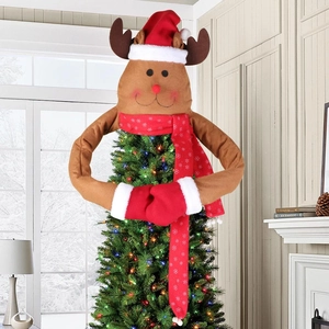 Plush Christmas reindeer tree topper with long hugger arms and festive snowflake scarf