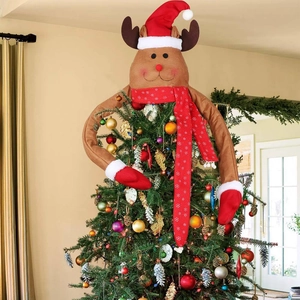 Detail view of a plush reindeer tree topper with long arms wrapping around a Christmas tree