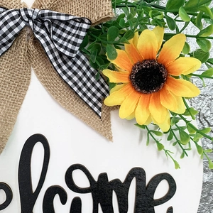 Wooden welcome sign wreath with yellow sunflower and black and white buffalo plaid bow