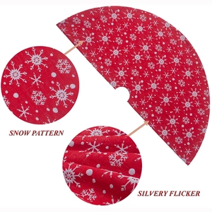 Red Christmas tree skirt with white snow patterns and silvery flicker fabric detail