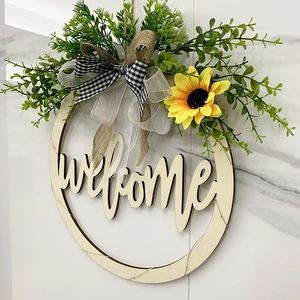 Wooden round welcome sign with sunflower decor and black-white checkered bow for home door