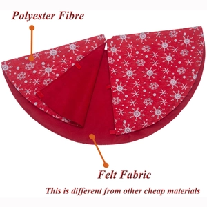 Red Christmas tree skirt with white snowflake patterns and soft felt backing
