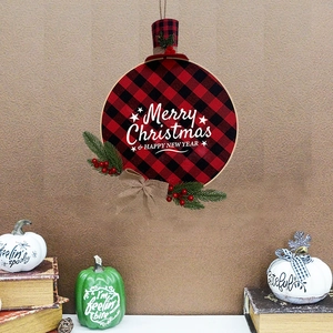 Red and black buffalo plaid Christmas wreath with pine needles and festive bow
