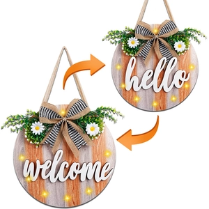 Lighted wooden welcome and hello door signs with rustic bow and spring floral accents
