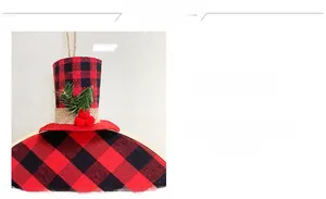 Detail of red and black buffalo plaid hat wreath with pine needles and red berries decor