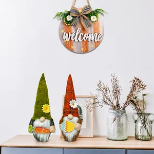 Easter home decor set featuring two plush gnomes and a wooden welcome sign with daisies