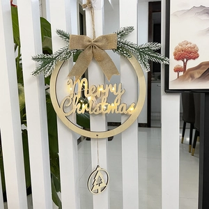 Detail of wooden Christmas wreath with LED lights, Merry Christmas text and burlap bow
