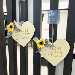 Set of two wooden heart-shaped welcome signs with sunflowers and striped bows for home decor