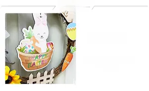 Detail of Easter wreath with rattan base, wooden bunny, carrots, and yellow sunflower