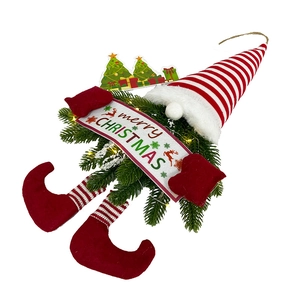Close-up of LED Christmas gnome wreath with Merry Christmas sign and pine needles
