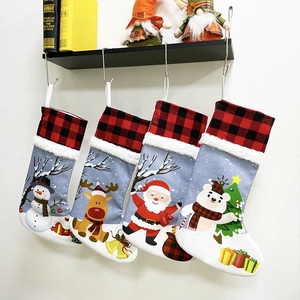 Detail of four Christmas stockings featuring Santa, reindeer, snowman and polar bear characters