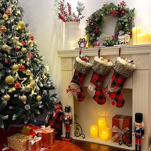 Set of three buffalo plaid Christmas stockings with Santa, snowman and reindeer motifs