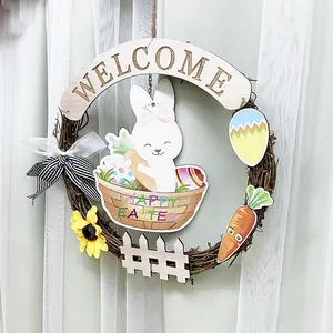 Detail of Easter wreath featuring bunny, carrots and Happy Easter sign on vine base