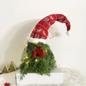 Christmas LED gnome with red knitted elk hat and green pine needles on white base