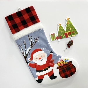 Classic Christmas stocking with Santa Claus print and red buffalo plaid cuff decoration