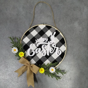 Easter wreath with Happy Easter text, buffalo plaid bunny, and yellow daisy decorations