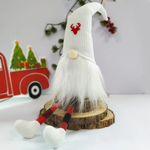 Detail of a Christmas gnome figurine with long legs on a rustic wood base background