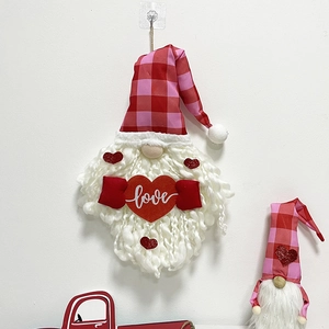 Close-up of Valentine gnome plush hanger with love heart and red checkered pointed hat
