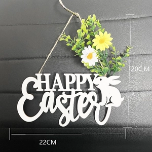 Close-up of Happy Easter wooden wreath with white daisies and bunny silhouette